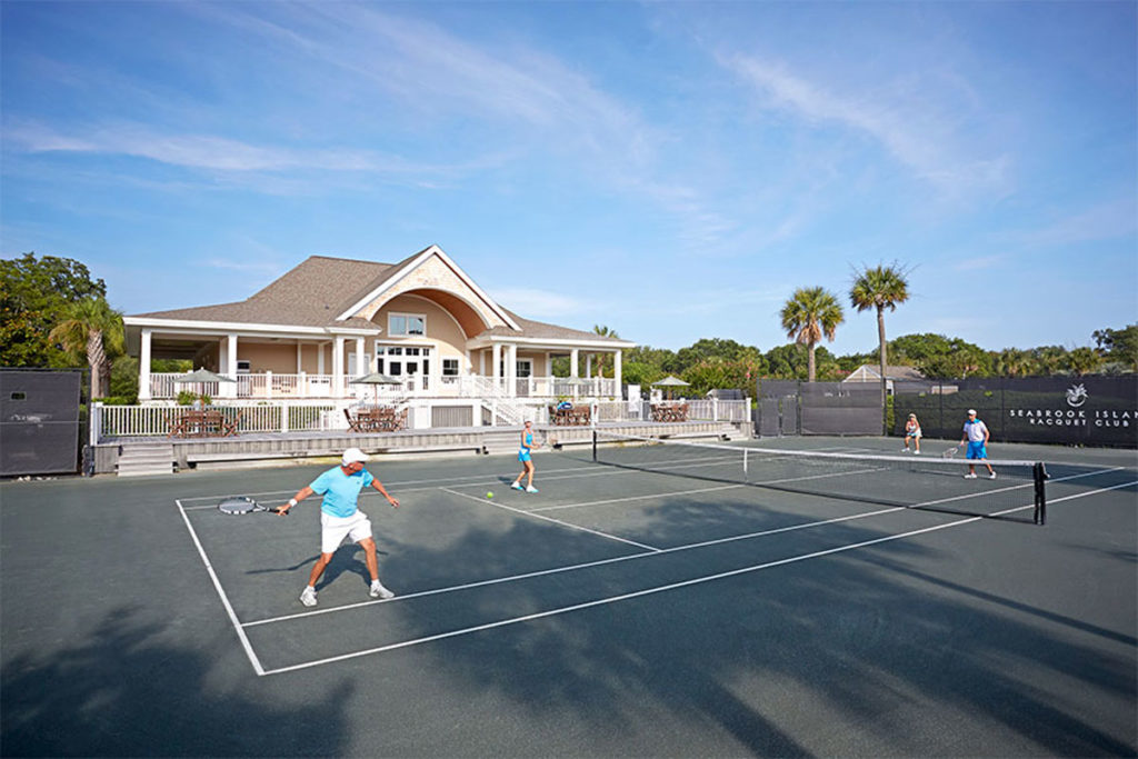 adults playing tennis for snowbird tennis on seabrook island clay courts